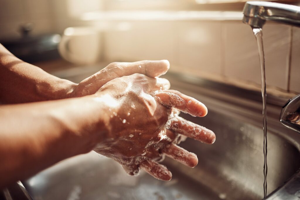 Shot of a man washing his hands